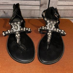 Black starfish gem sandals with zip back.
